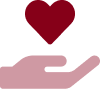 A red heart is placed on top of a hand.